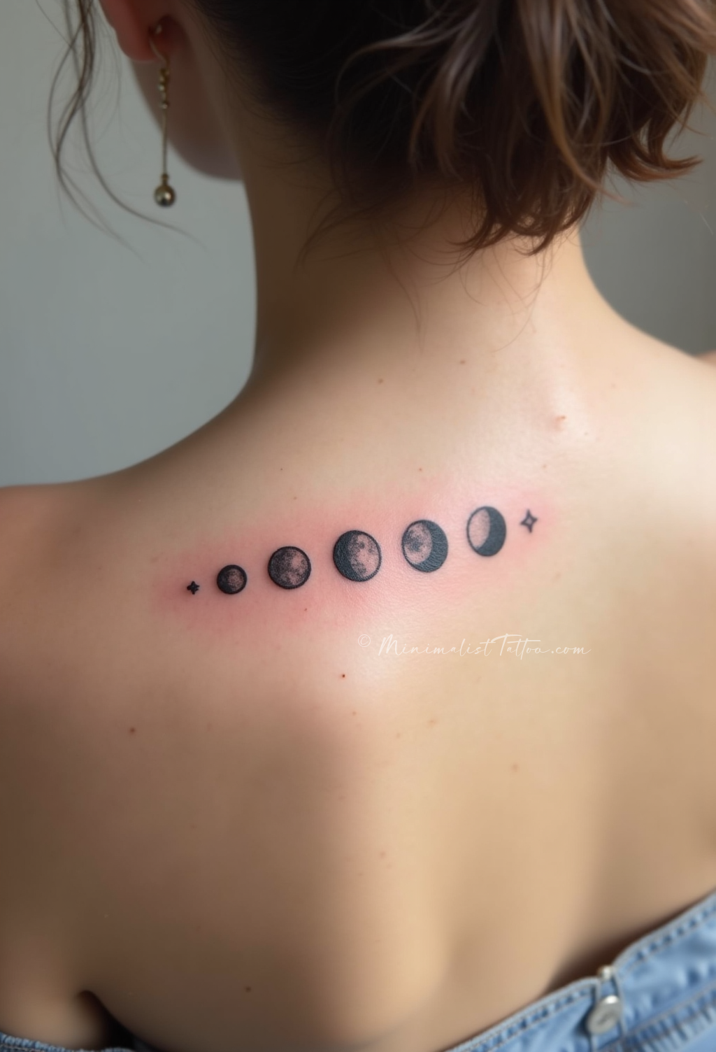 Minimalist moon phases spine tattoo