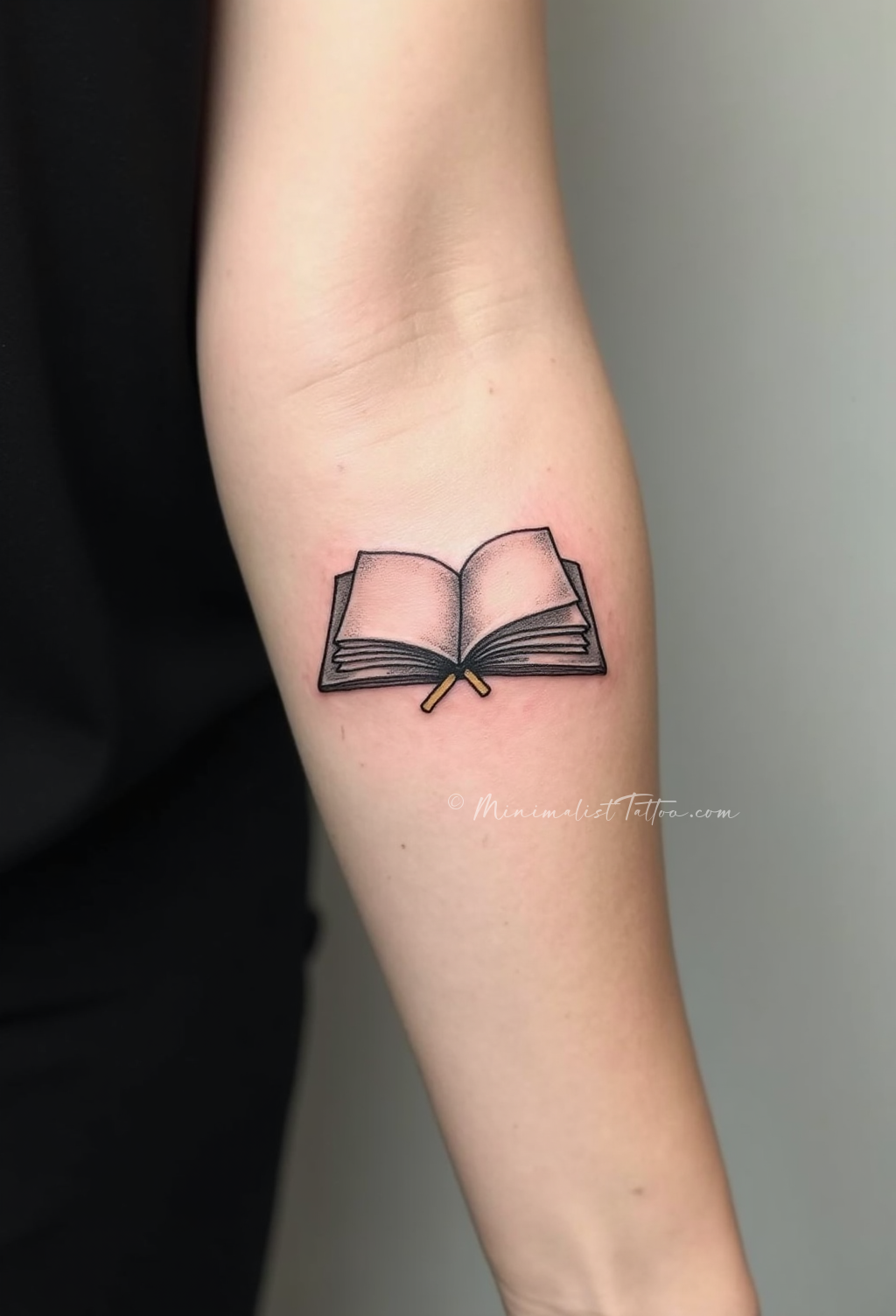 Minimalist book forearm tattoo
