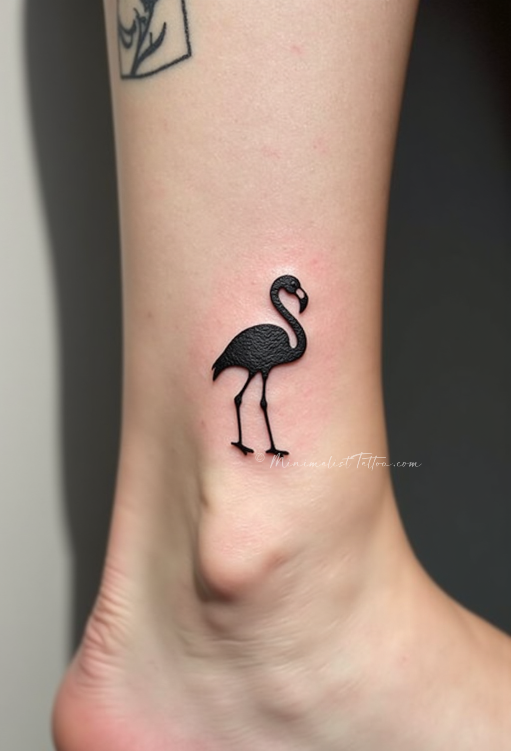 Minimalist flamingo ankle tattoo
