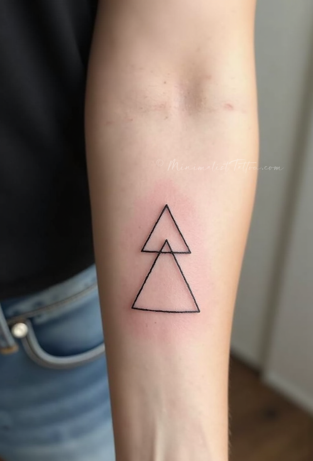 Minimalist geometric triangle tattoo